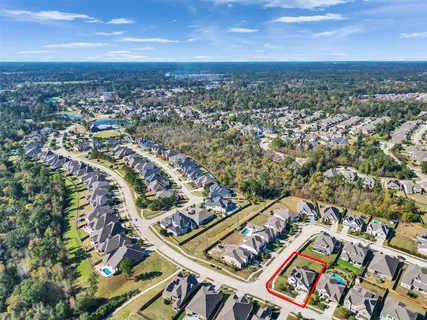 an aerial view of houses with outdoor space