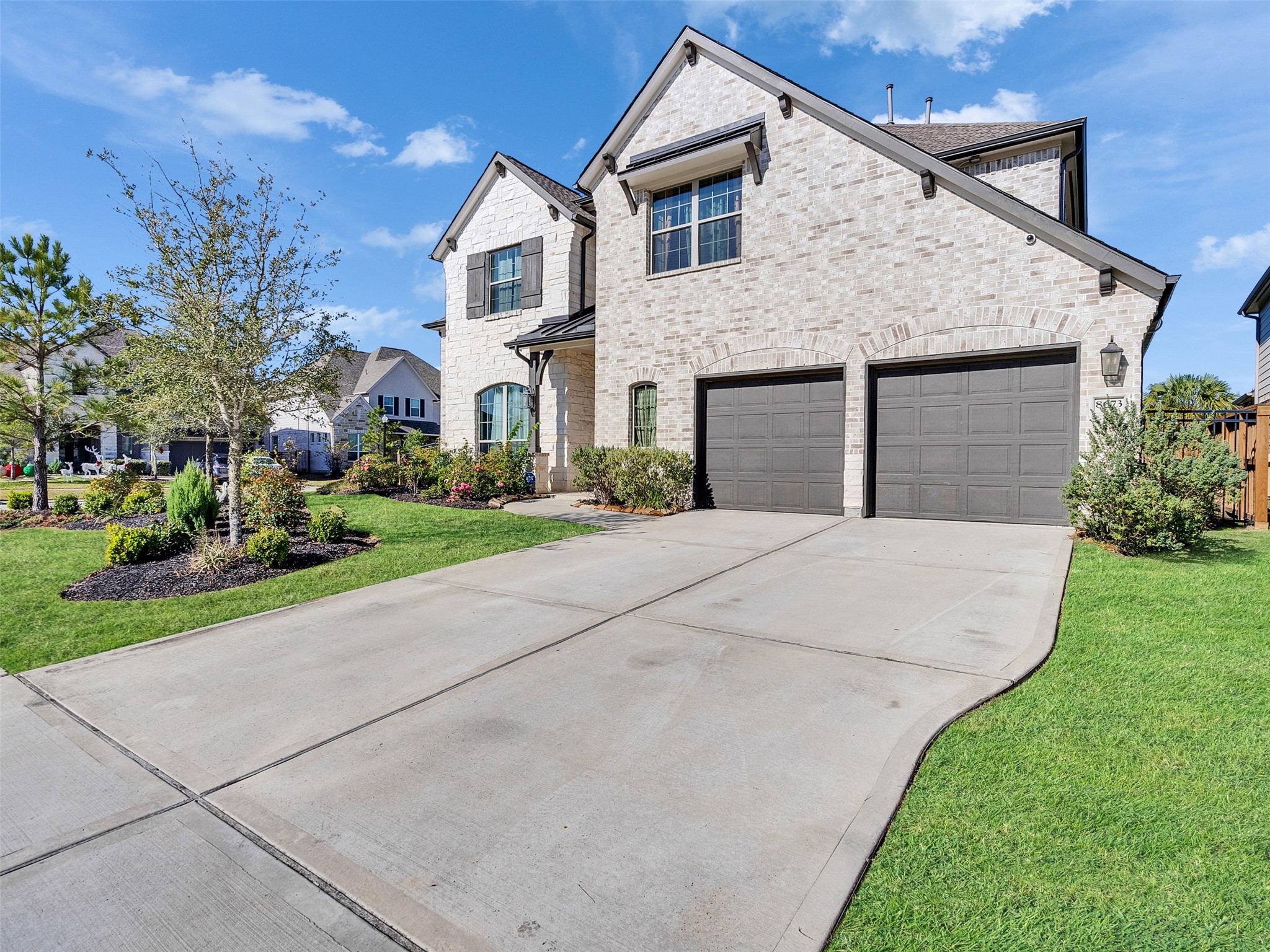 8673 Burdekin Road Magnolia, TX 77354 - Photo 5 of 48 a front view of house with yard and green space