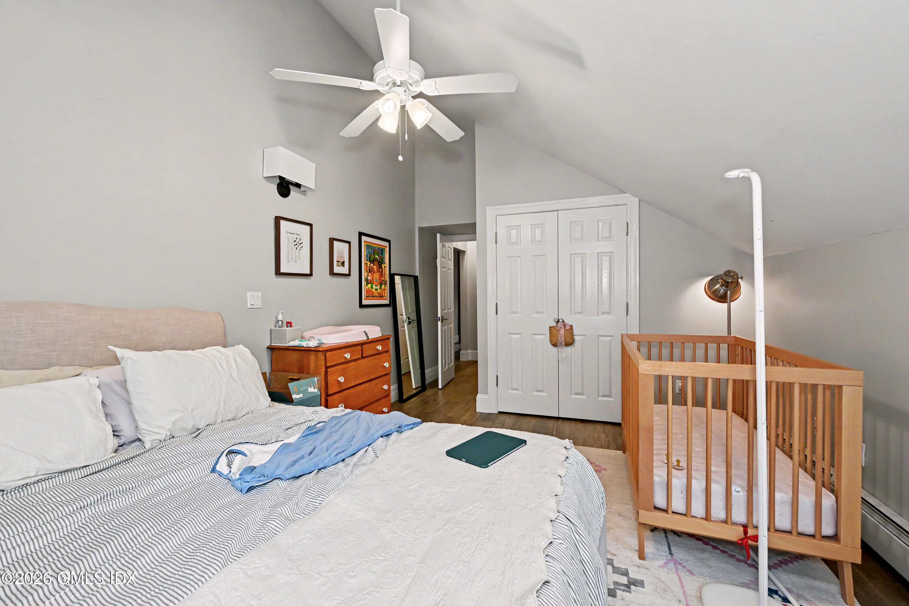 37 Prospect Street Greenwich, CT 06830 - Photo 29 of 41 a bedroom with a bed and a chandelier