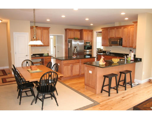 32 Howarth Drive Upton, MA 01568 - Photo 8 of 26 a kitchen with stainless steel appliances kitchen island granite countertop a sink and cabinets