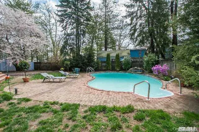 a view of a backyard with a patio