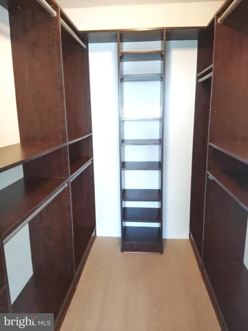 a view of closet area with empty racks