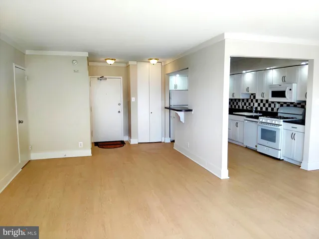 a view of a kitchen with a sink and a stove top oven