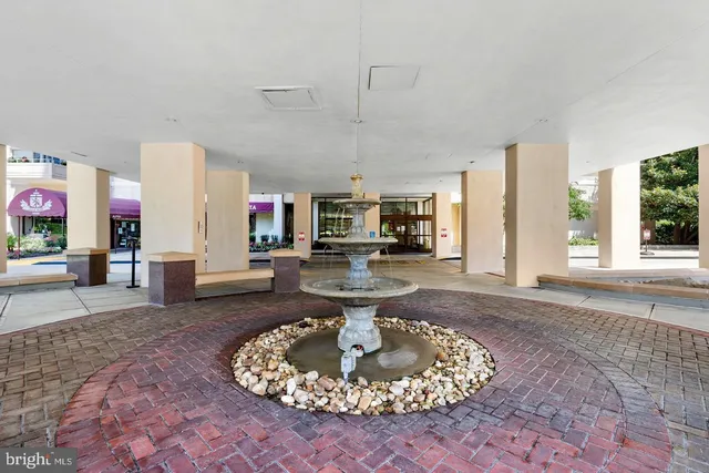 a view of a building with potted plants
