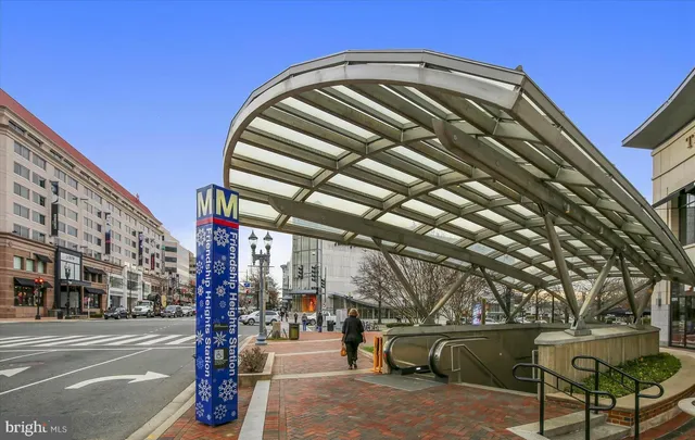 a front view of a house with plants and entryway
