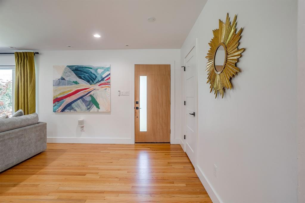 6700 Fortune Road Fort Worth, TX 76116 - Photo 6 of 40 Hardwood flooring throughout a bright interior space with recessed lighting