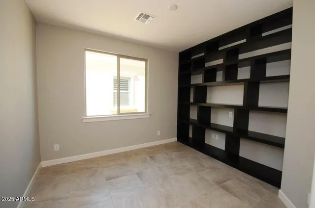 a view of a room with window and closet