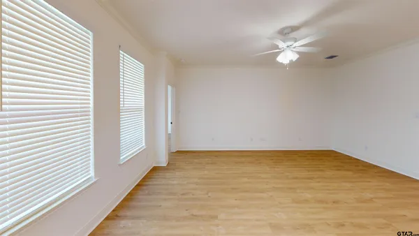 a view of an empty room with a window
