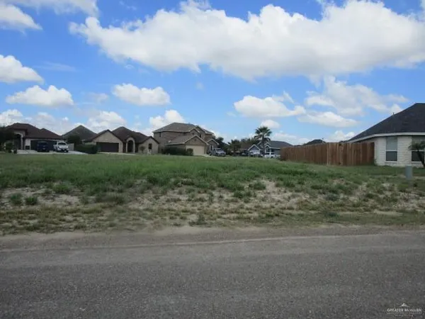 a view of a town with mountains in the background