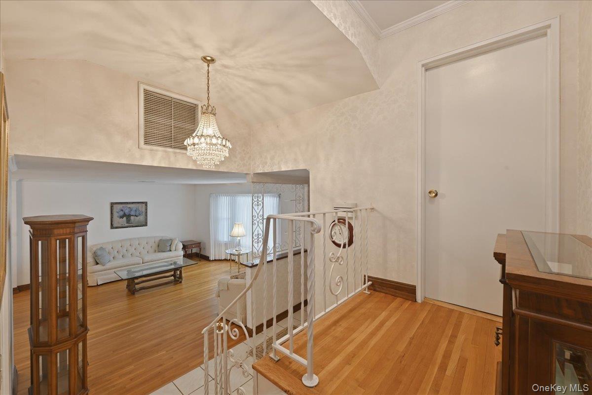 17 Avon Road Farmingdale, NY 11735 - Photo 15 of 46 a view of a livingroom with furniture a dinning room and chandelier