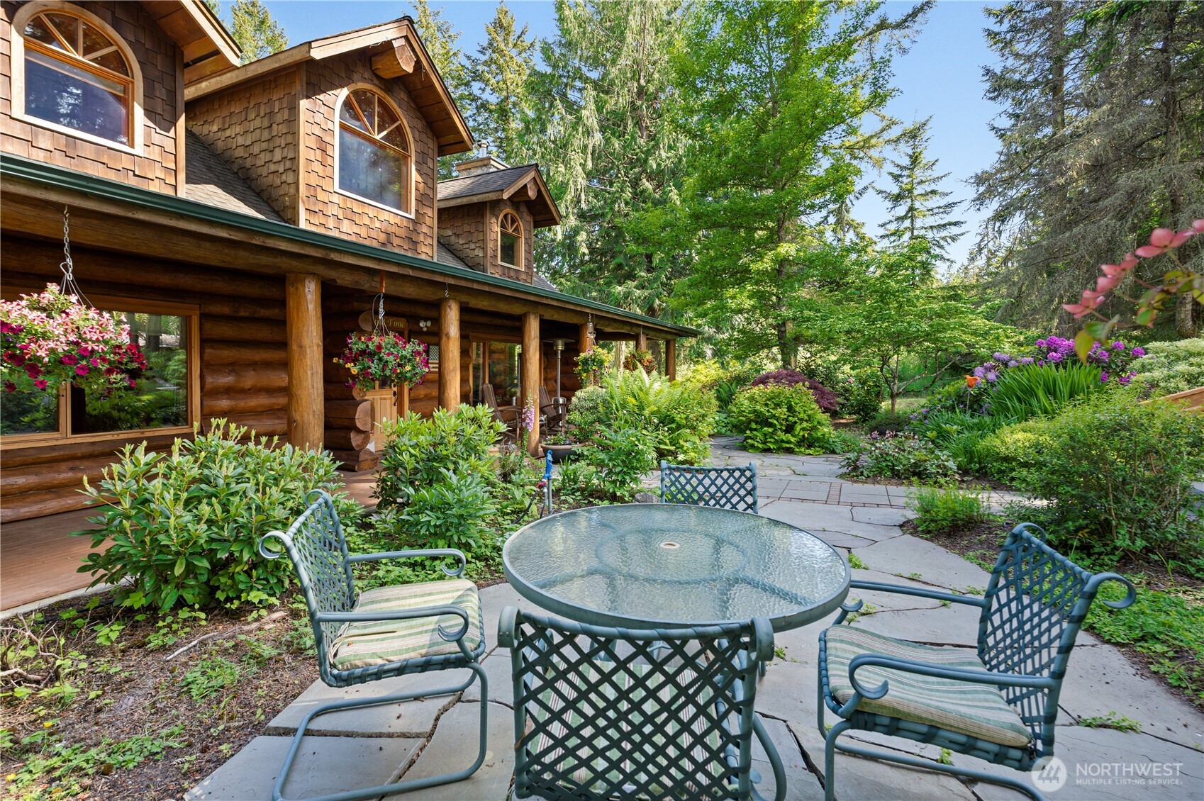 134 Sacred Moon Way Friday Harbor, WA 98250 - Photo 4 of 35 a view of a patio with table and chairs and potted plants