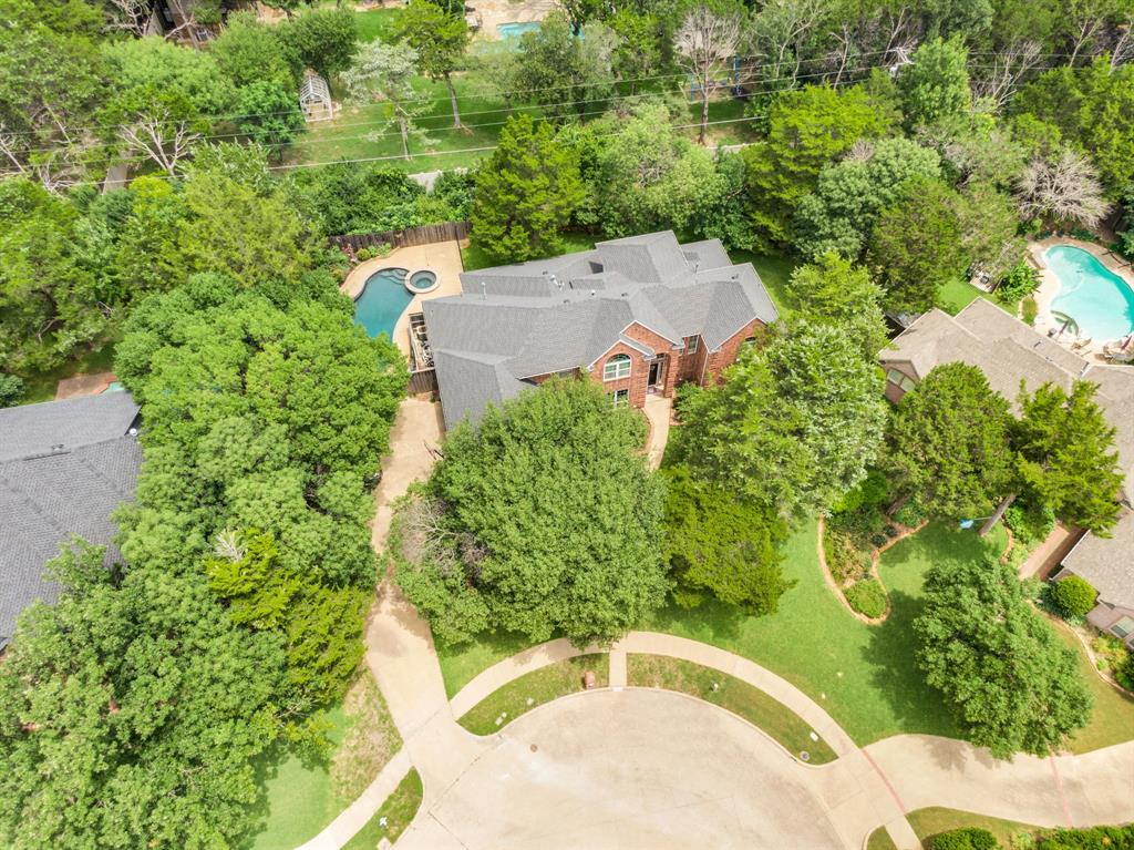 1907 Timber Ridge Court Cedar Hill, TX 75104 - Photo 2 of 30 Brick exterior home with a dark shingle roof situated on a cul-de-sac