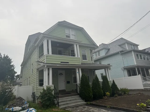 a car parked in front of a house