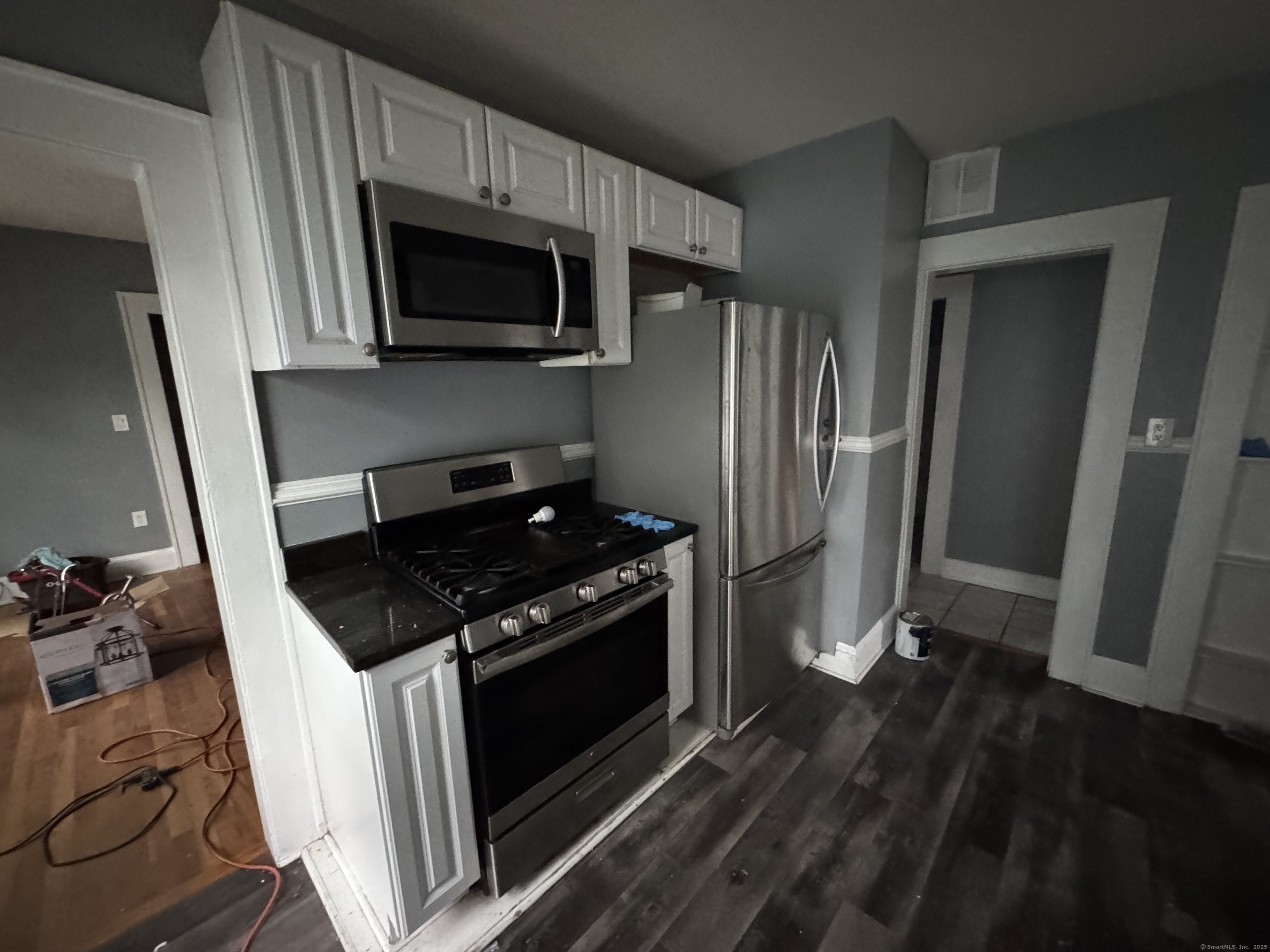 65 Palm Street Bridgeport, CT 06610 - Photo 7 of 13 a kitchen with a stove and a microwave