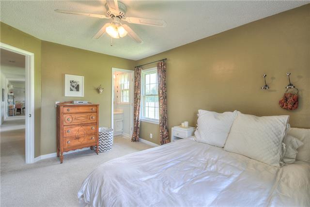 4736 Midland Road Christiana, TN 37037 - Photo 7 of 19 The master bedroom is warm and inviting. Master bathroom has new cultured marble top and Delta faucet. Walk in shower
