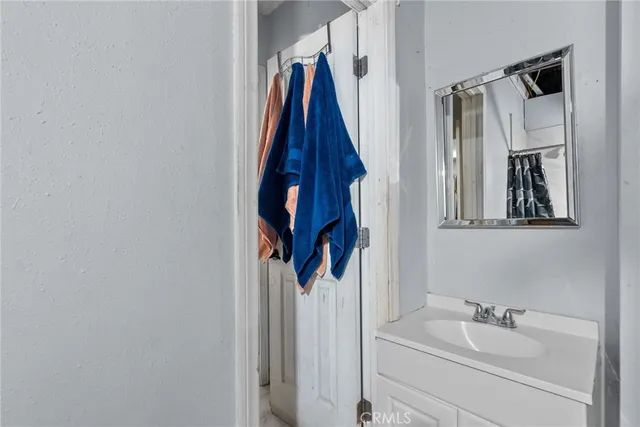 a bathroom with a sink and mirror