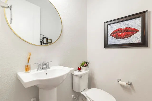a bathroom with a toilet and a sink