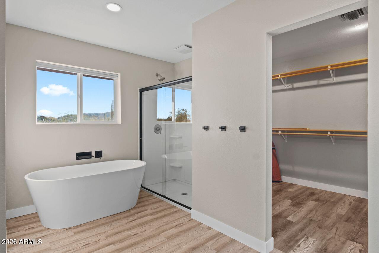 51718 West Donald Road Aguila, AZ 85320 - Photo 14 of 59 a white bath tub sitting next to a white sink