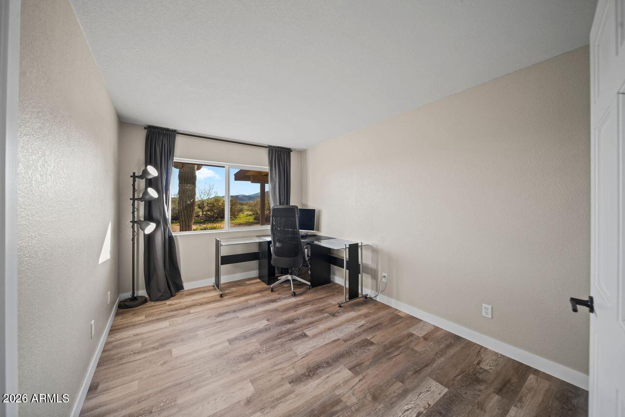 51718 West Donald Road Aguila, AZ 85320 - Photo 18 of 59 a view of a workspace with furniture and a window