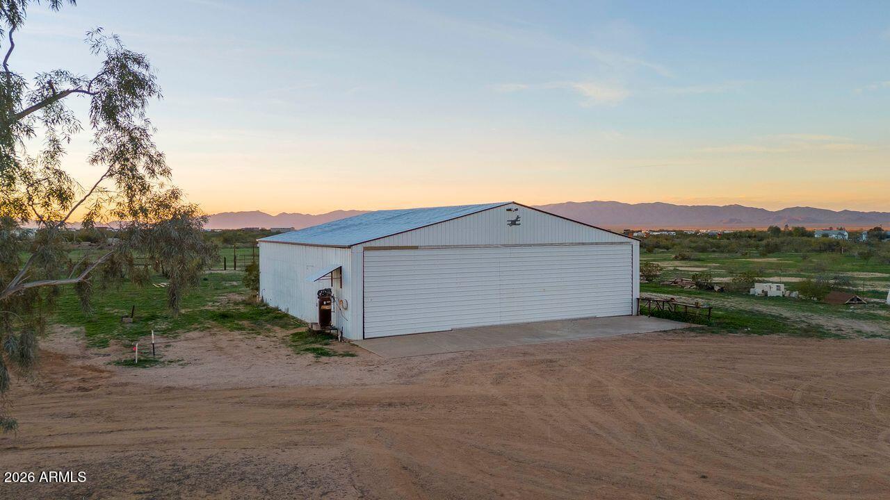 51718 West Donald Road Aguila, AZ 85320 - Photo 26 of 59 a view of a house with a yard and garage