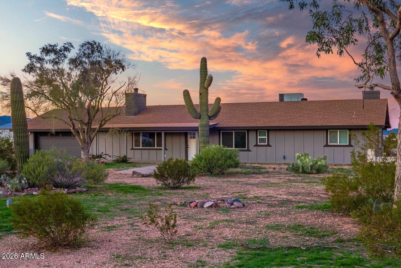 51718 West Donald Road Aguila, AZ 85320 - Photo 33 of 59 a front view of a house with garden