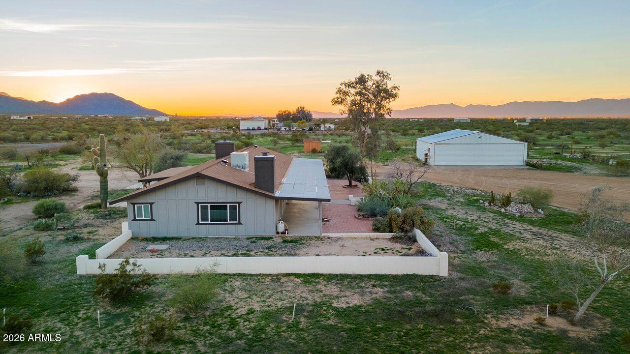 51718 West Donald Road Aguila, AZ 85320 - Photo 39 of 59 a front view of a house with a yard and mountain view in back