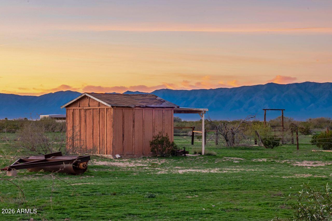 51718 West Donald Road Aguila, AZ 85320 - Photo 44 of 59 a view of a backyard with potted plants and mountain view