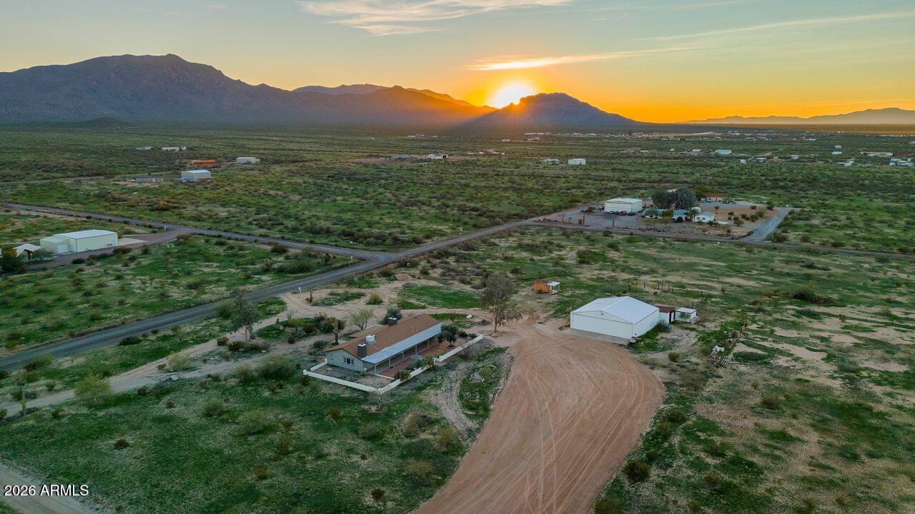 51718 West Donald Road Aguila, AZ 85320 - Photo 53 of 59 a view of a lush green hillside and houses