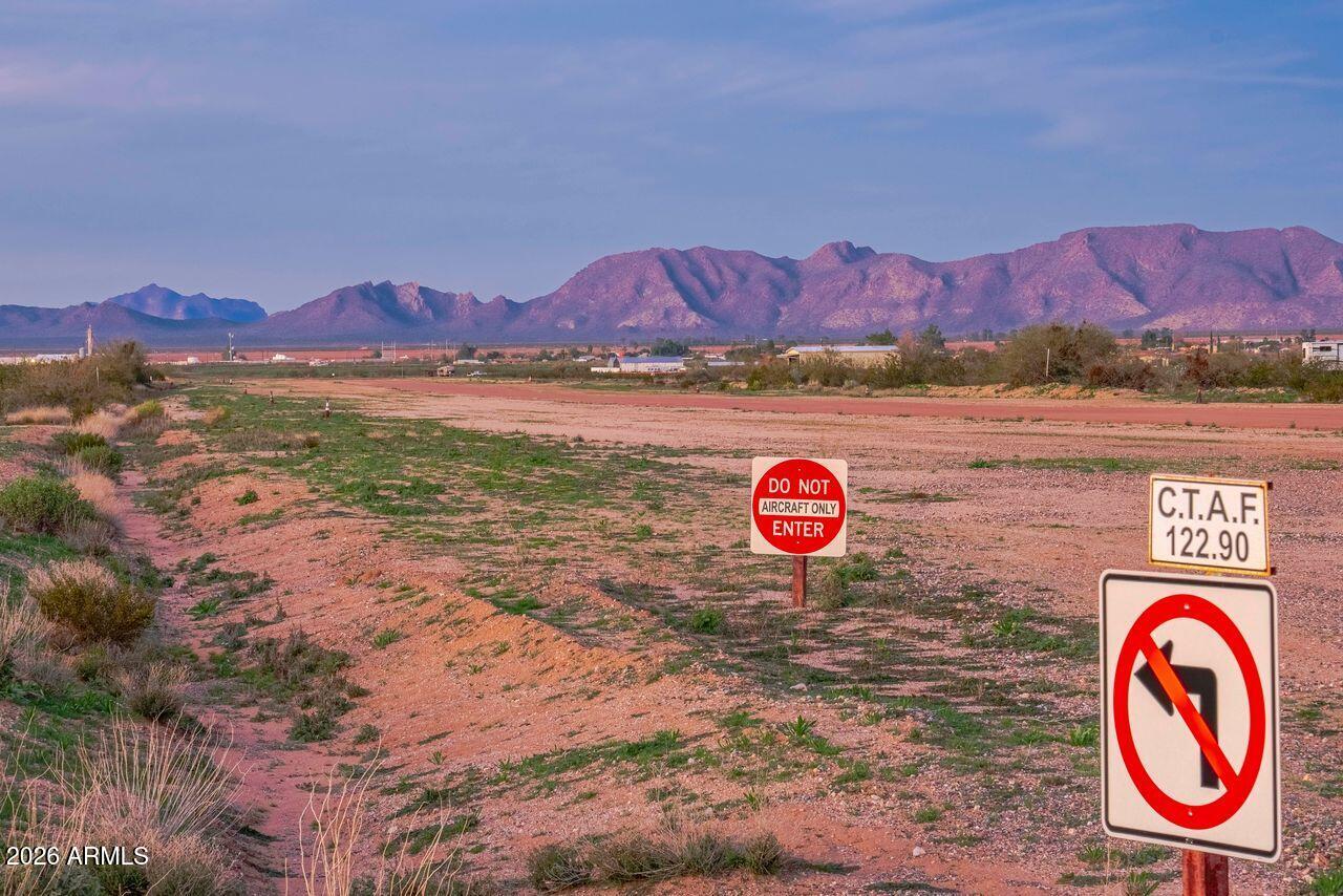 51718 West Donald Road Aguila, AZ 85320 - Photo 57 of 59 a view of a street with a sign board