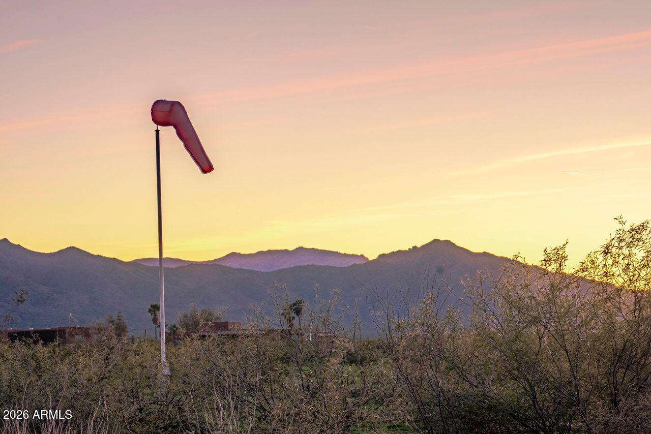 51718 West Donald Road Aguila, AZ 85320 - Photo 59 of 59 a view of a house with a mountain and a forest