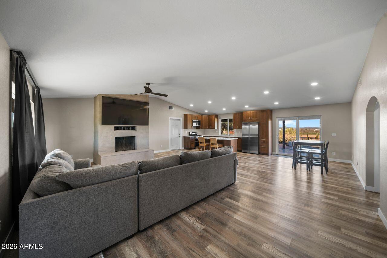 51718 West Donald Road Aguila, AZ 85320 - Photo 9 of 59 a living room with furniture and a wooden floor