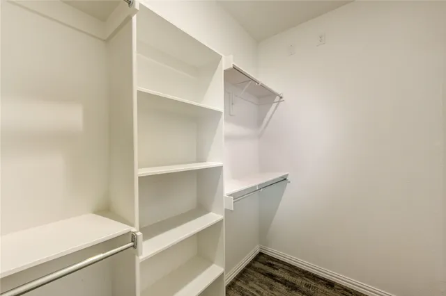 a view of an empty walk in closet