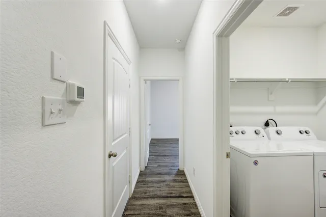 a view of a hallway with utility room