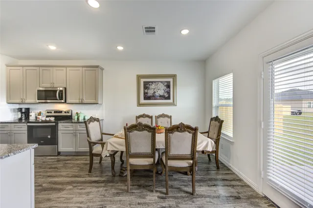 a view of a dining room with furniture