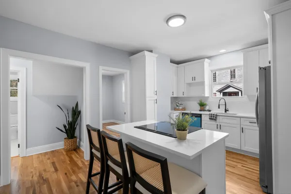 a kitchen with a table and chairs in it