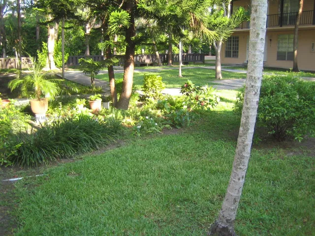 a view of street with a building in the background
