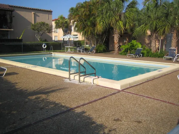 a view of a street with cars parked