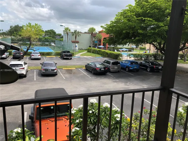 an empty room with wooden floor and closet