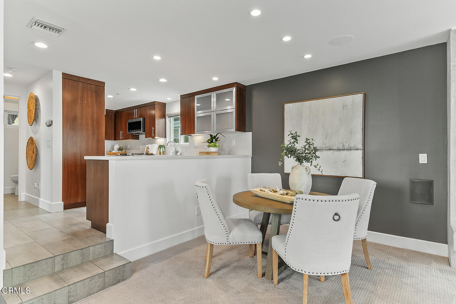 92 B Surfside Avenue Surfside, CA 90743 - Photo 16 of 47 a dining room with kitchen island furniture a chandelier and kitchen view