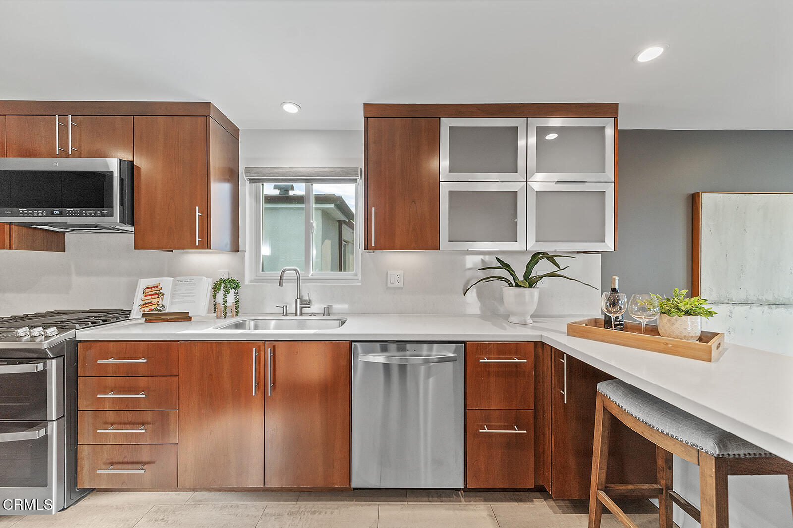 92 B Surfside Avenue Surfside, CA 90743 - Photo 18 of 47 a kitchen with a sink cabinets and window