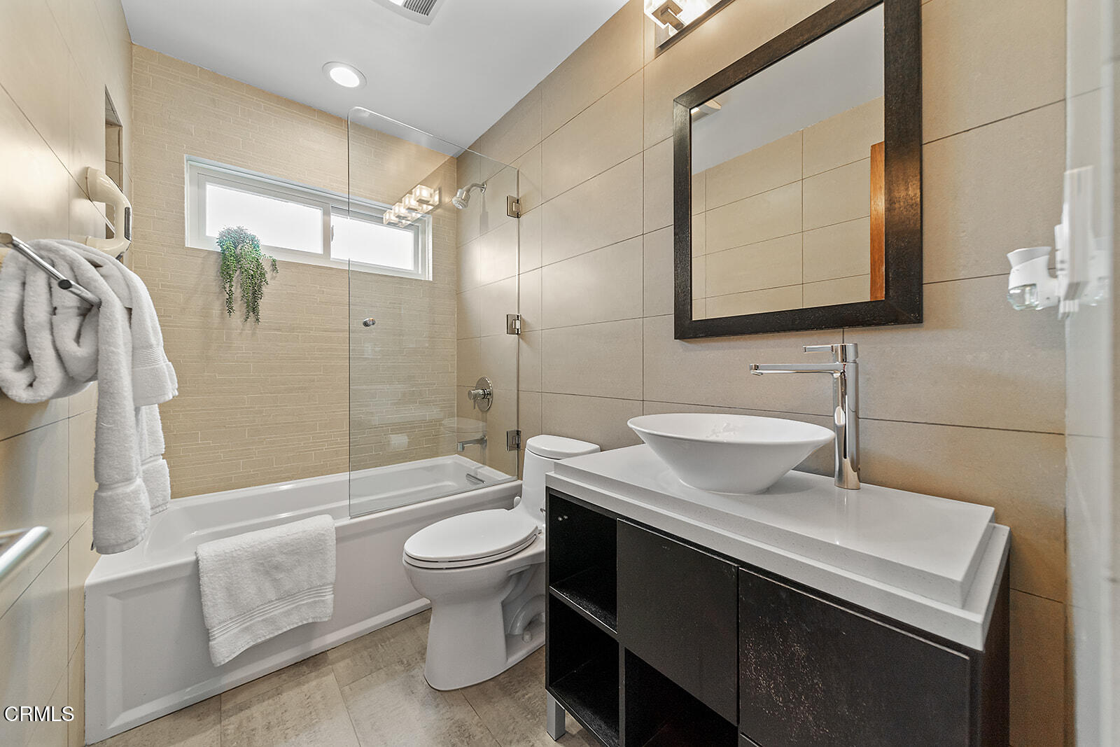 92 B Surfside Avenue Surfside, CA 90743 - Photo 27 of 47 a bathroom with a sink a toilet and shower