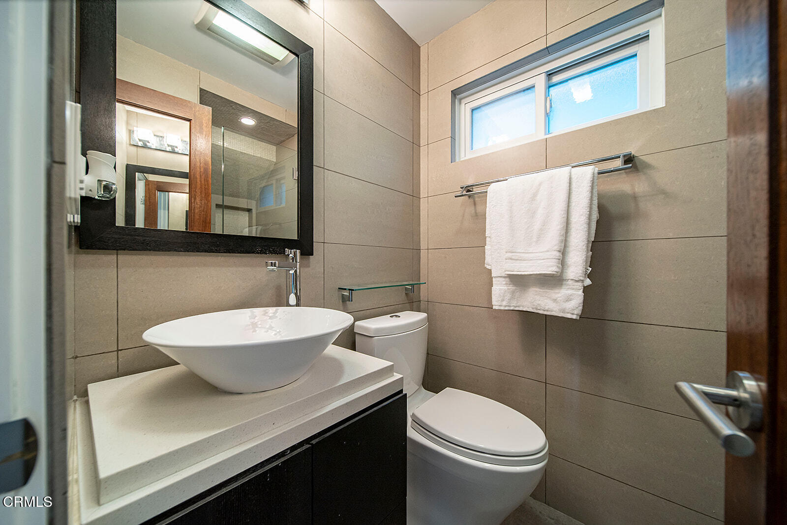 92 B Surfside Avenue Surfside, CA 90743 - Photo 30 of 47 a bathroom with a sink toilet and mirror