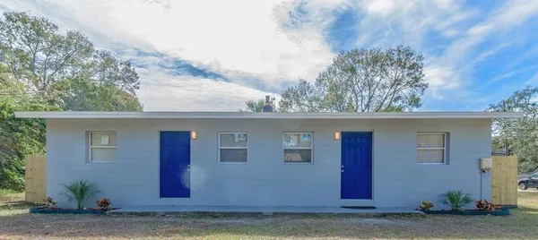 a view of a house with a yard