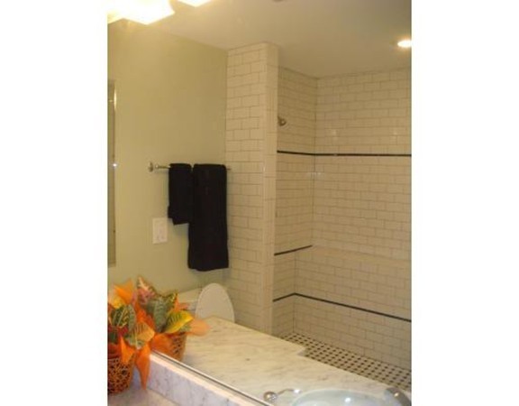 39 Juliette Street, Unit 3 Boston, MA 02122 - Photo 11 of 20 a bathroom with a sink and a mirror
