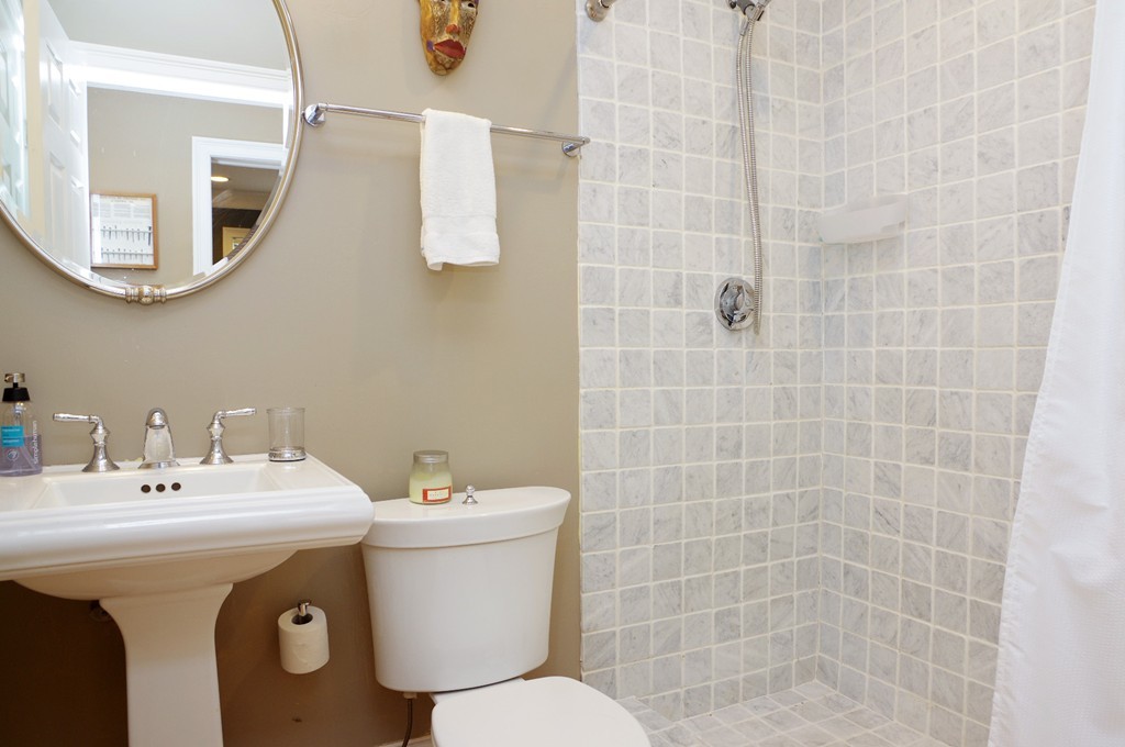 39 Juliette Street, Unit 3 Boston, MA 02122 - Photo 12 of 20 a bathroom with a sink mirror and toilet