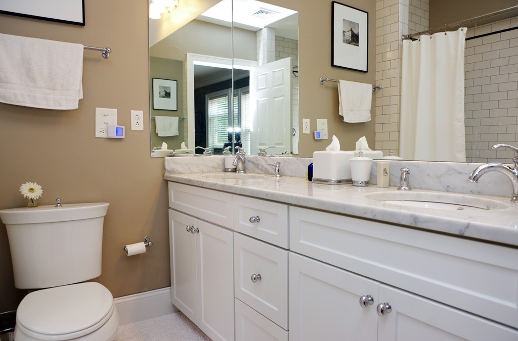 39 Juliette Street, Unit 3 Boston, MA 02122 - Photo 14 of 20 a bathroom with a granite countertop toilet sink and mirror