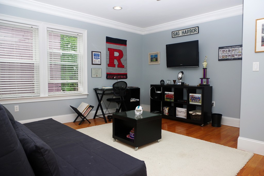 39 Juliette Street, Unit 3 Boston, MA 02122 - Photo 15 of 20 a living room with furniture and a flat screen tv