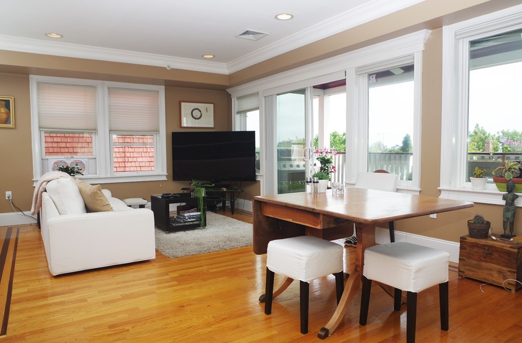 39 Juliette Street, Unit 3 Boston, MA 02122 - Photo 6 of 20 a living room with furniture and a flat screen tv