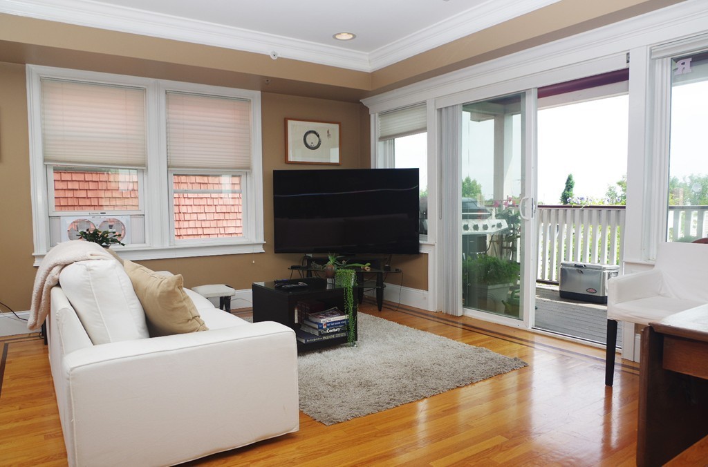 39 Juliette Street, Unit 3 Boston, MA 02122 - Photo 7 of 20 a living room with furniture and a flat screen tv
