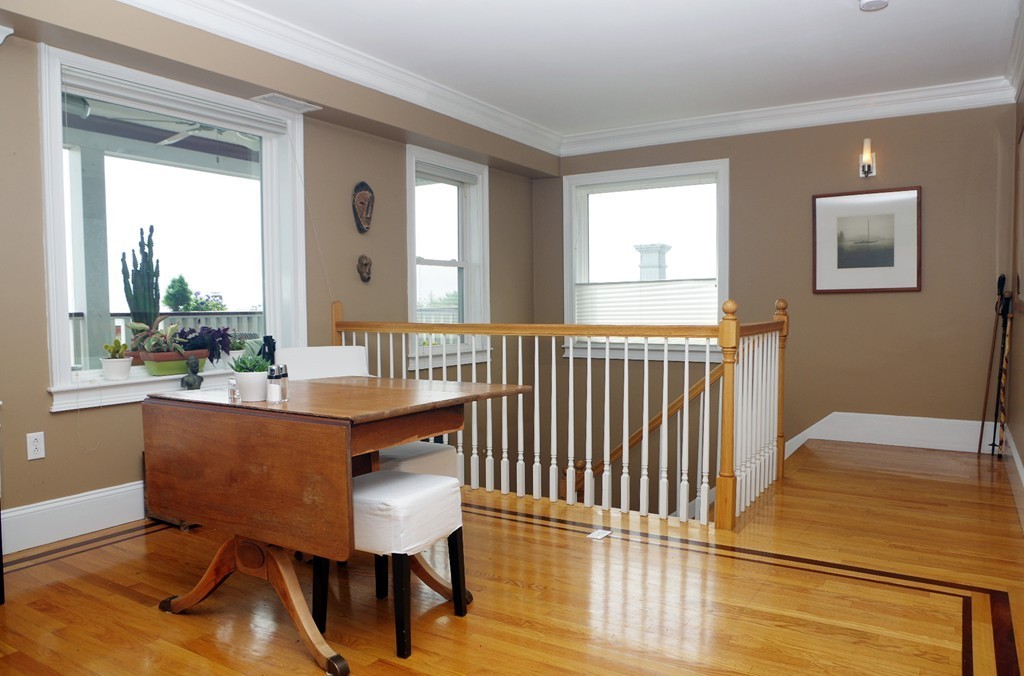 39 Juliette Street, Unit 3 Boston, MA 02122 - Photo 8 of 20 a view of a dining room with furniture and wooden floor